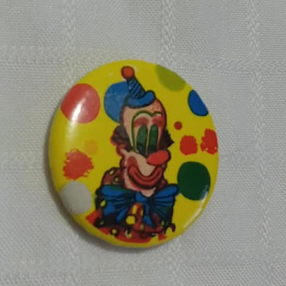 Strange & unusual vintage button pin featuring a clown